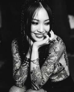 25 yo Tattooed Smilling Asian woman